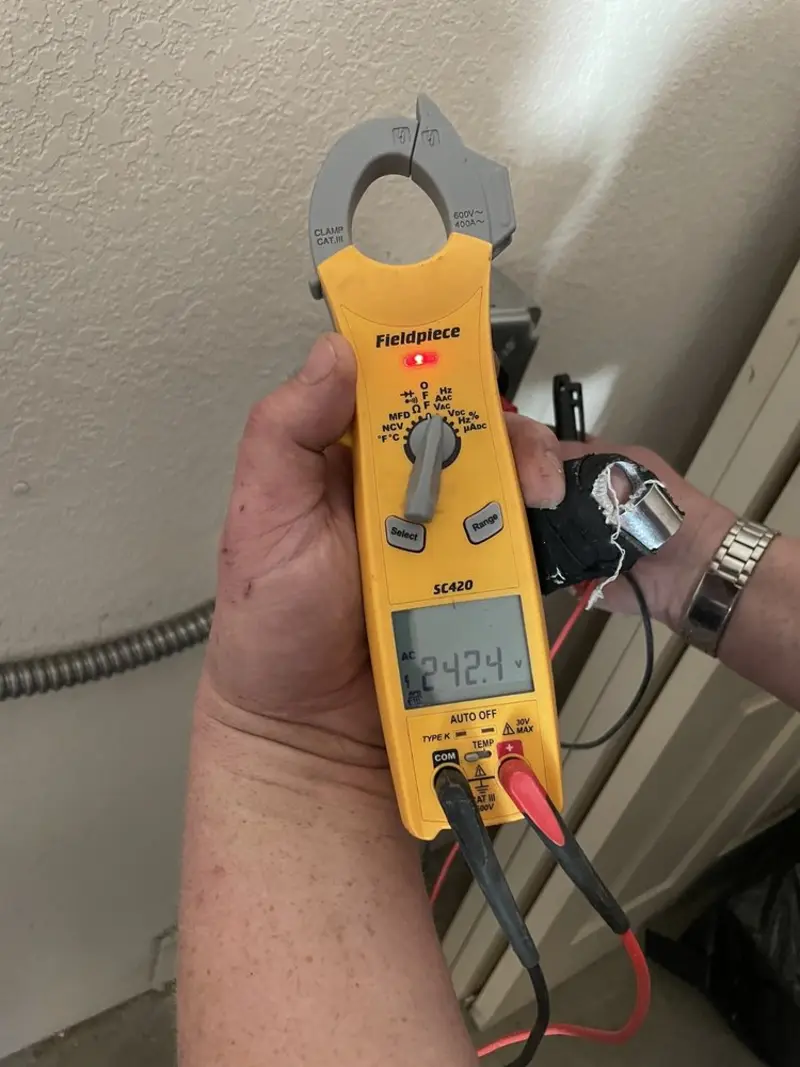 Voltage testing with clamp meter during Ceiling Fan Installation in Chelsea